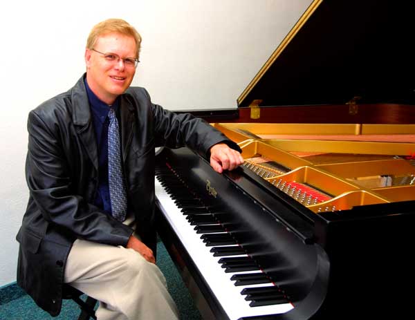 Dr Walden Hughes with his Piano